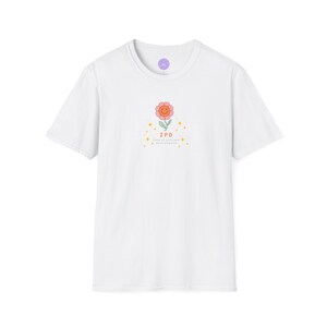 May include: White t-shirt with a pink and orange flower graphic and the text "ZPD Zone of Proximal Development".