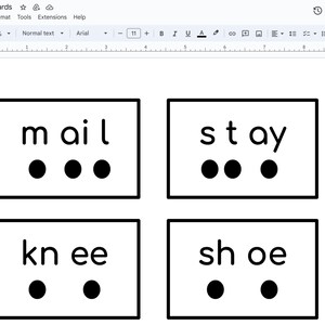 May include: Four black and white cards with the words "mail", "stay", "knee", and "shoe" written on them. Each word is segmented into individual phonemes, represented by black dots.