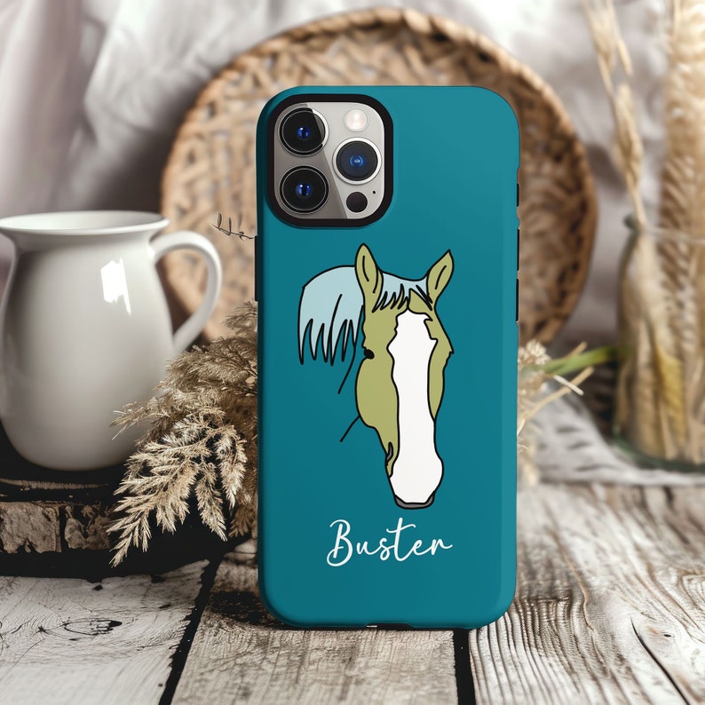 May include: A teal blue phone case with a white outline of a horse's head and the word "Busten" printed on the bottom.