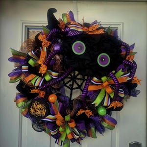 Spider Halloween Wreath: 24&quot; Black Mesh, Neon Eyes & Rainbow Ribbon