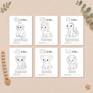 Printable ABC coloring pages G through L with cute animal illustrations of a gorilla, horse, iguana, jaguar, koala, and lion.