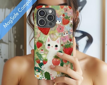 May include: A phone case featuring a whimsical design with a white cat, strawberries, and flowers. The case has a colorful, floral background with the text "MagSafe Compatible" in a diagonal blue banner.