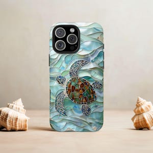 May include: A blue and green iPhone case with a stained glass design of a sea turtle swimming in the ocean waves.