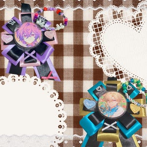 May include: Two decorative rosettes featuring circular anime character badges. The top left rosette has black and purple ribbons with pink heart accents and a beaded loop spelling DURIN. The bottom right rosette has black and gold ribbons with blue heart accents and a beaded loop spelling AVENTRINE.