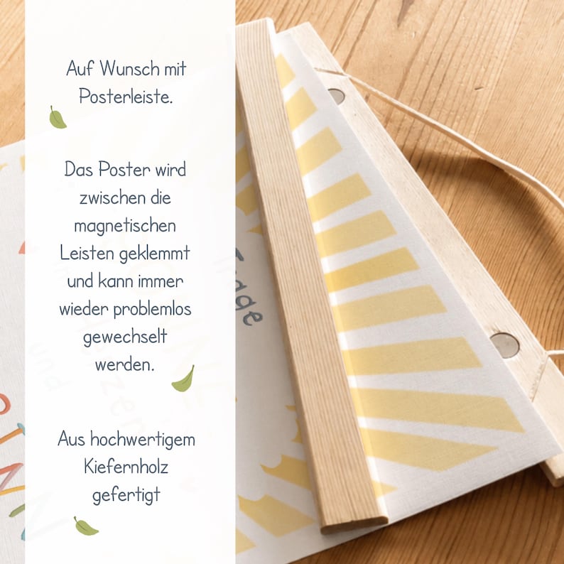 May include: A poster hanging system with wooden magnetic strips. The poster is held between the strips and can be easily changed. The text on the poster says "Auf Wunsch mit Posterleiste" and "Aus hochwertigem Kiefernholz gefertigt".