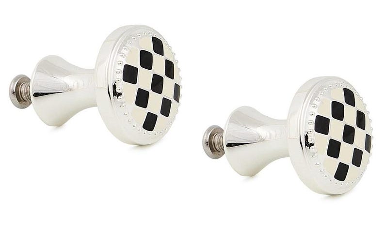 May include: Two silver-toned metal cabinet knobs featuring a circular face with a black and cream-colored checkered diamond pattern. Each knob has a beaded edge detail and a threaded metal screw extending from the back for installation purposes.