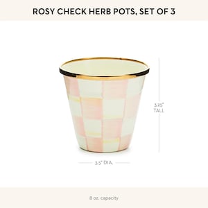 May include: A Rosy Check herb pot with a pink and white checkered pattern and a gold-tone rim. The pot is 3.25 inches tall, has a 3.5-inch diameter, and an 8 oz. capacity. The text Rosy Check Herb Pots, Set of 3 is visible at the top.