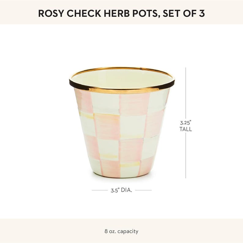 May include: A Rosy Check herb pot with a pink and white checkered pattern and a gold-tone rim. The pot is 3.25 inches tall, has a 3.5-inch diameter, and an 8 oz. capacity. The text Rosy Check Herb Pots, Set of 3 is visible at the top.