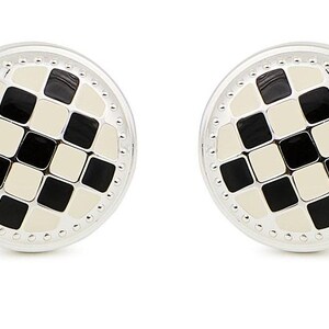 May include: A pair of round cufflinks featuring a silver-toned metal border with a beaded edge. The center of each cufflink displays a grid pattern of alternating black and off-white square tiles, creating a classic checkerboard design.