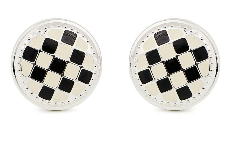 May include: A pair of round cufflinks featuring a silver-toned metal border with a beaded edge. The center of each cufflink displays a grid pattern of alternating black and off-white square tiles, creating a classic checkerboard design.