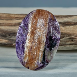 Rare Tinaksite with Charoite palm stone both sides polished.Wide Tinaksite crystals dual side cabochon 47x34mm.