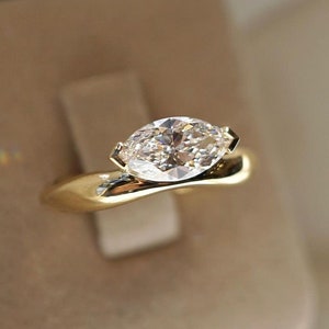 Custom order: 4 CT. marquise cut moissanite ring in 14 k gold