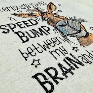 May include: Embroidered design of a donkey with the text "I seriously need a speed bump between my brain and my mouth."