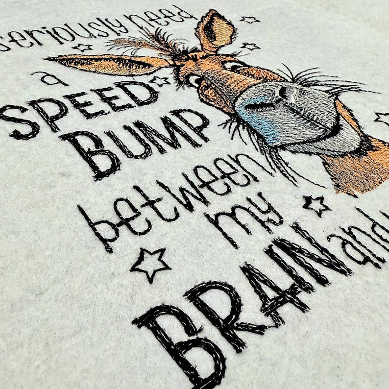 May include: Embroidered design of a donkey with the text "I seriously need a speed bump between my brain and my mouth."