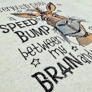 May include: Embroidered design of a donkey with the text "I seriously need a speed bump between my brain and my mouth."
