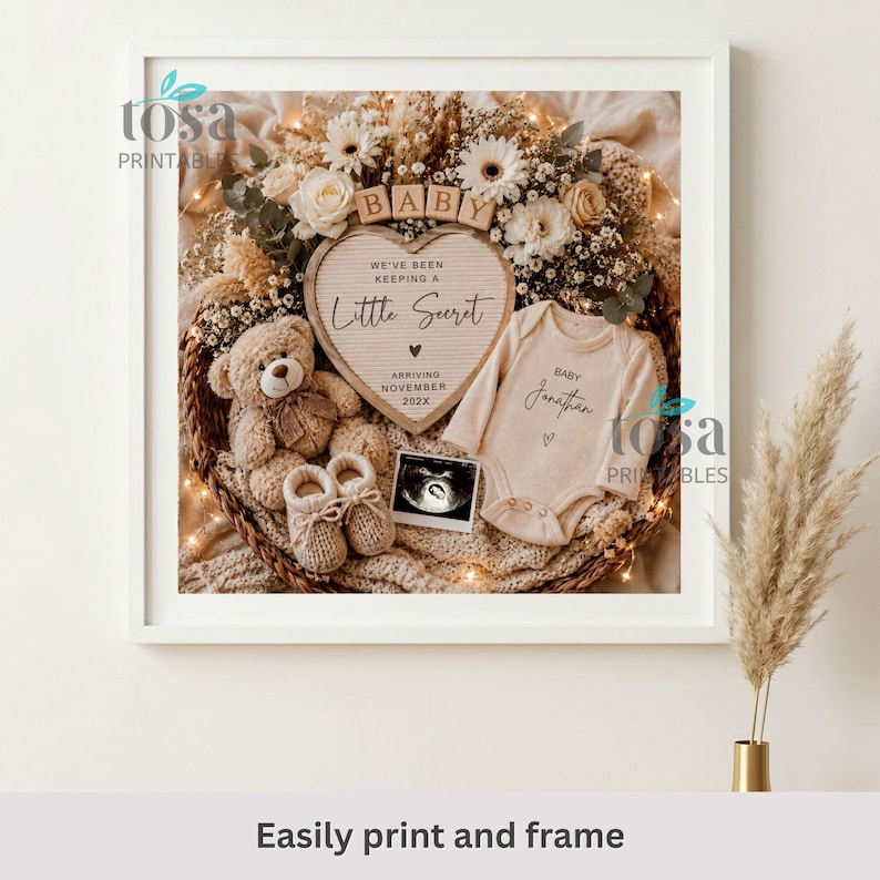 May include: A framed announcement display featuring a heart-shaped letter board with the text We've been keeping a little secret arriving November 202X, a beige baby bodysuit labeled Baby Jonathan, a teddy bear, baby booties, and an ultrasound photo.