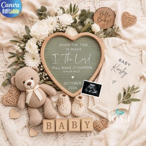 May include: A heart-shaped green felt letter board with white text reading WHEN THE TIME IS RIGHT, I, THE LORD WILL MAKE IT HAPPEN. ISAIAH 60:22 OCTOBER 202X, surrounded by white flowers, a knit teddy bear, baby booties, a onesie, and wooden blocks.