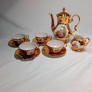 Vintage Bavaria Gold tea set, Victorian scenes painted, possibly gold plated, German made, cups with saucers, tea pot and milk jug, patina