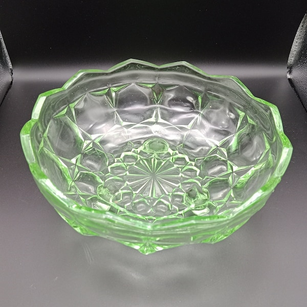 Vintage green uranium glass 3 footed fruit bowl, scalloped edge