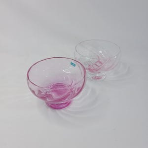 A Caithness cranberry pink glass footed bowl and a Caithness Flamenco  swirl footed bowl circa 1970&#39;s, ice cream or fruit cup, dessert bowl