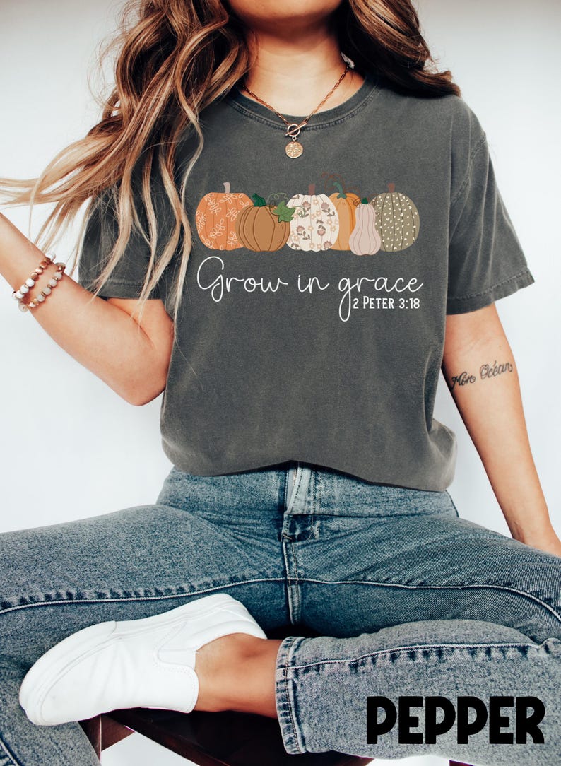 May include: A gray t-shirt with a row of five colorful pumpkins and the text "Grow in grace 2 Peter 3:18".