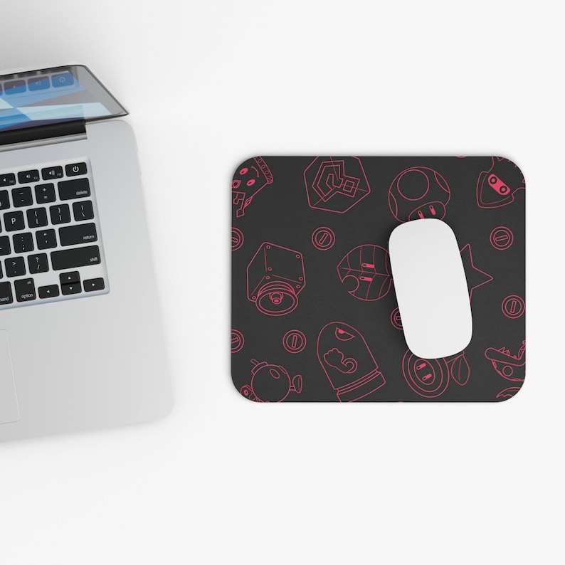 May include: A black mouse pad with a pink outline of video game characters and objects. The mouse pad has a repeating pattern of coins, stars, a mushroom, a shell, a leaf, and a block.