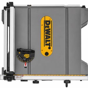 May include: A grey DeWalt table saw with a yellow throat plate featuring the black DeWalt logo. The tool includes a black mitre gauge with yellow markings, a silver metal fence, and a yellow ruler scale along the front edge for precise cutting.