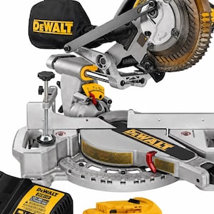 May include: A DeWalt compound mitre saw with a silver metal base, a black dust collection bag, and yellow accents. The tool features a circular blade, a mitre scale, and a clamp. Included are a black battery charger and a yellow battery pack.