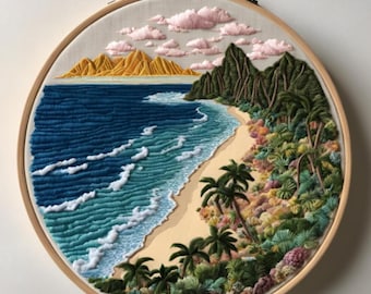 May include: Embroidered hoop art depicting a tropical beach scene with palm trees, lush greenery, and a sandy shore. The ocean is a vibrant blue with white foamy waves. The mountains in the background are a golden yellow.