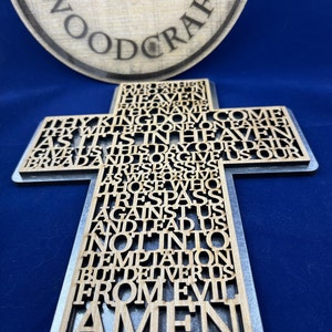 Lord prayer laser cut into the sign of cross