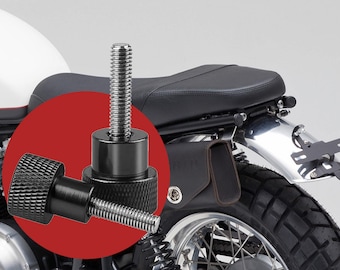May include: Close-up of a black motorcycle bolt with a knurled head and threaded shaft. The bolt is shown against a motorcycle's rear section, including the seat, fender, and tire. The bolt is designed for motorcycle customization.