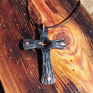 Forged cross pendant