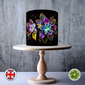 Des fleurs magiques colorées s'enroulent autour d'un gâteau comestible, d'une feuille de glaçage, d'une carte gaufrette, d'une pellicule de gâteau, d'impressions comestibles