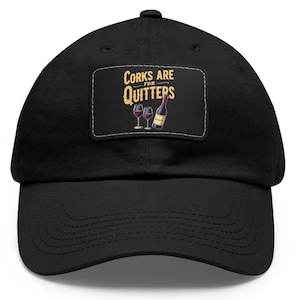 May include: Black baseball cap with a white patch that says "Corks are for Quitters" in yellow text. The patch also features a bottle of wine and two wine glasses.