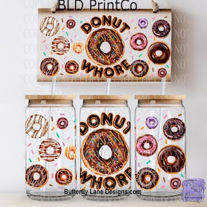 May include: Three glass tumblers with wooden lids and straws, featuring a donut design with the text "DONUT WHORE". A wooden sign with the same design hangs above. Various donut illustrations and sprinkles are scattered around.