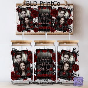May include: A set of three glass tumblers with bamboo lids and a wooden sign, all featuring a design with images of two people, roses, and the text "Twilight" and "And so the lion fell in love with the lamb". The sign is suspended by a rope.