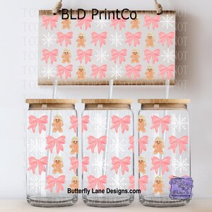 May include: Three clear glass jars with wooden lids and straws, decorated with pink bows, gingerbread men, and snowflakes. A matching sign above displays the same pattern. The text "BLD PrintCo" and "Butterfly Lane Designs.com" are visible.