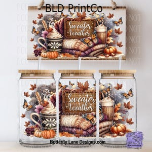 May include: Clear glass tumblers with wooden lids, featuring a fall-themed design. The design includes a sign that says "Sweater Weather", pumpkins, butterflies, and a cozy stack of blankets. The tumblers are perfect for seasonal beverages.
