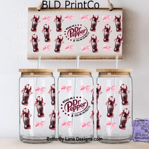 May include: Three clear glass tumblers with bamboo lids and straws, decorated with Dr. Pepper bottles and pink bows. A matching sign hangs above. The sign and tumblers feature the text "Bring Me a Dr. Pepper & Tell Me I'm Pretty."