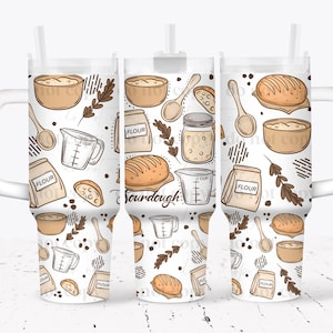 May include: A white tumbler with a wraparound design featuring sourdough baking elements. The design includes illustrations of bread, flour bags, measuring cups, spoons, and the word "Sourdough". The tumbler has a white handle and a straw.