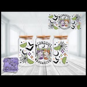 May include: Three glass tumblers with bamboo lids and straws, decorated with Halloween-themed graphics. Each tumbler features a "Midnight Margaritas" design with bats, spiderwebs, and lime slices. The design includes a purple and orange cocktail with skeleton hands.