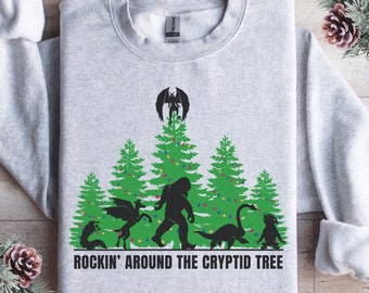 Cryptid Collections Sweatshirt, rockin around Christmas, Cryptozoologist Shirt, Cryptid Shirt, Mothman Shirt, Bigfoot Shirt, Loch Ness Shirt