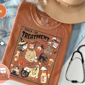 Comfort Colors® Halloween Nurse Shirt, Retro Spooky Nurse Gift for Women Pumpkin Girly Fall Nursing Tshirt Hospital Ghost Boo Tee Black Cats