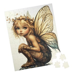 May include: A detailed illustration of a fairy with large, intricate wings. The fairy is sitting on a rock with a delicate floral pattern on her body. The wings are a mix of gold, yellow, and blue.