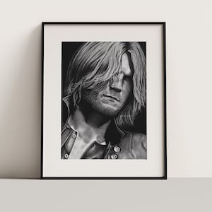 May include: Black and white drawing of a man with long hair, wearing a leather jacket. The drawing is framed in a black frame.