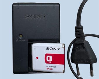Carregador original Sony BC-CSGB para baterias NP-BG1 e câmeras Cyber-shot.
