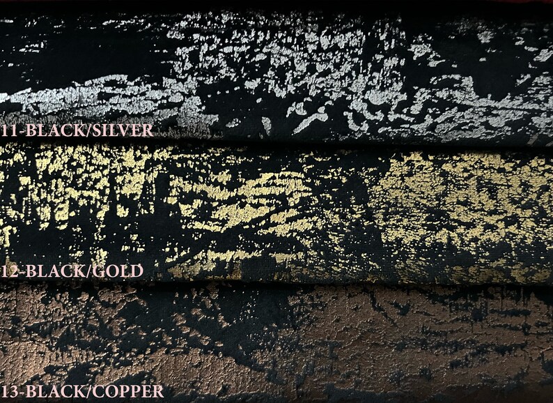 May include: Three fabric swatches with a black background and a metallic finish. The top swatch has a silver finish, the middle swatch has a gold finish, and the bottom swatch has a copper finish. The swatches are labeled with the text "11-BLACK/SILVER", "12-BLACK/GOLD", and "13-BLACK/COPPER".