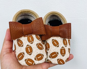 Leopard Footballs Bow Moccs| Texas Moccs Handmade Baby Moccasins - Soft Sole Infants&#39; Booties Football Baby