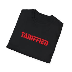 May include: Black t-shirt with the word "TARIFFED" printed in red.