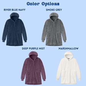 May include: Image shows four hooded, long-sleeved robes in various colors: River Blue Navy, Smoke Grey, Deep Purple Mist, and Marshmallow. Each robe has a hood, a half-zip closure, and two front pockets. The text "Color Options" is at the top.